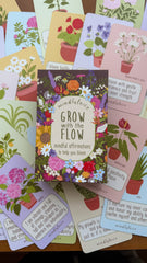 Collection of 'Grow with the Flow' mindfulness cards on a wooden surface.
