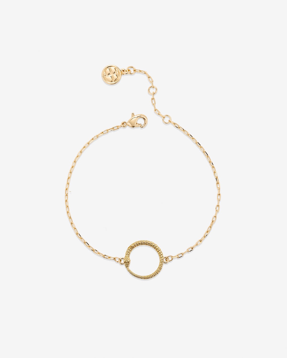 Gold bracelet with a circular charm on a white background