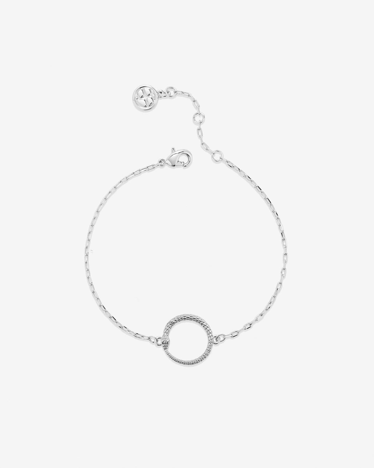 Silver bracelet with a circular design on a light gray background