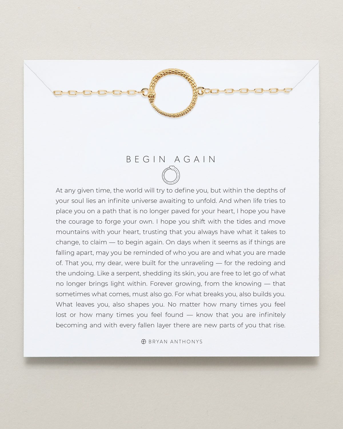 Gold bracelet on a card with text and a quote by Bryan Anthony