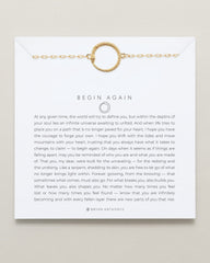 Gold bracelet on a card with text and a quote by Bryan Anthony