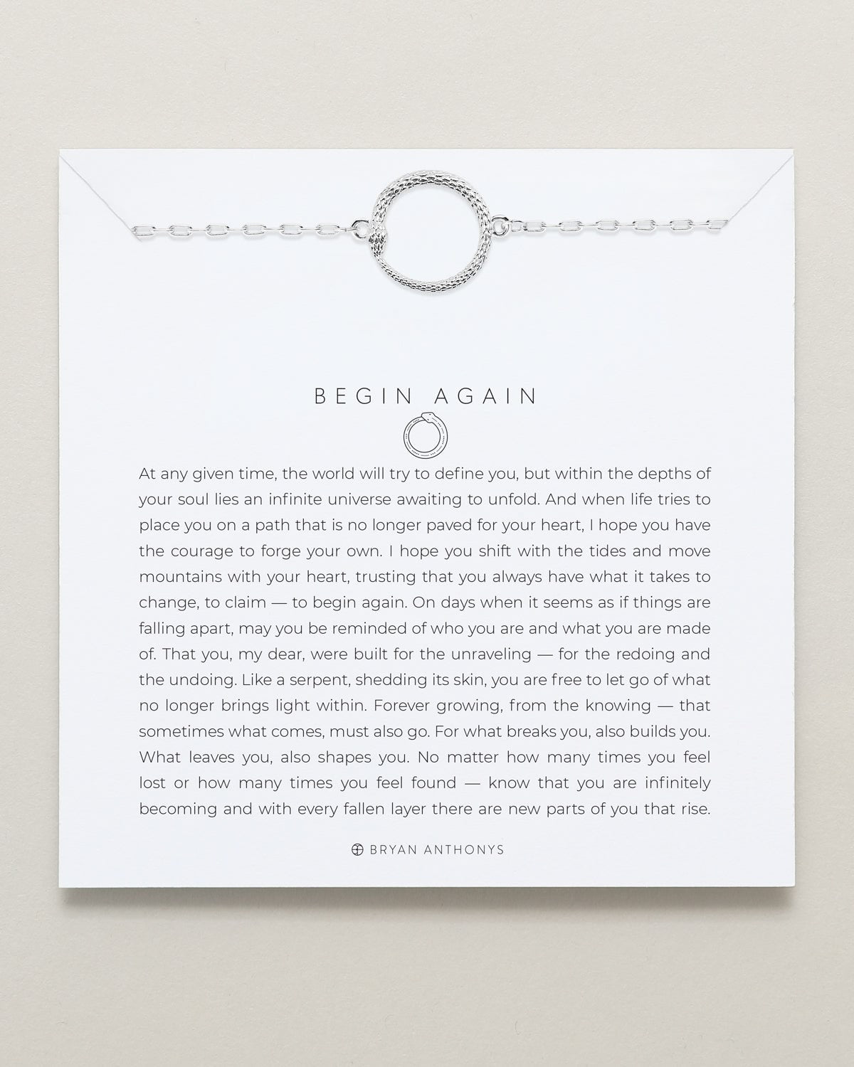 Bracelet on a card with text and branding