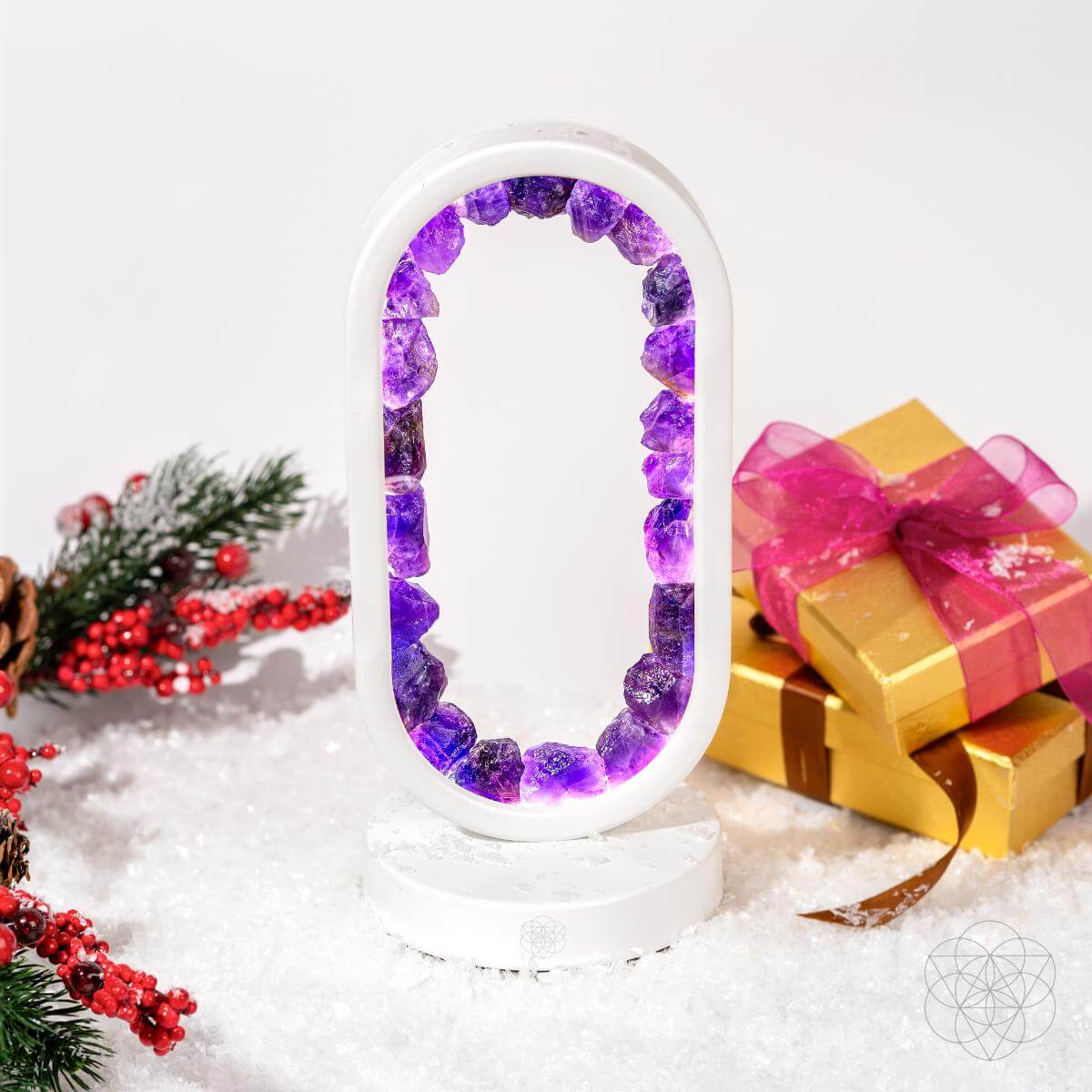Decorative letter 'O' with purple and white beads, surrounded by Christmas decorations on a white background.